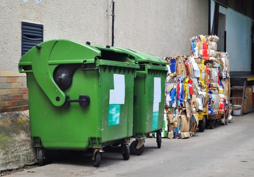 Workers wearing PPE and loading a van for clearance